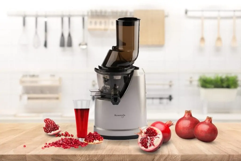Making pomegranate juice with cold press juicer