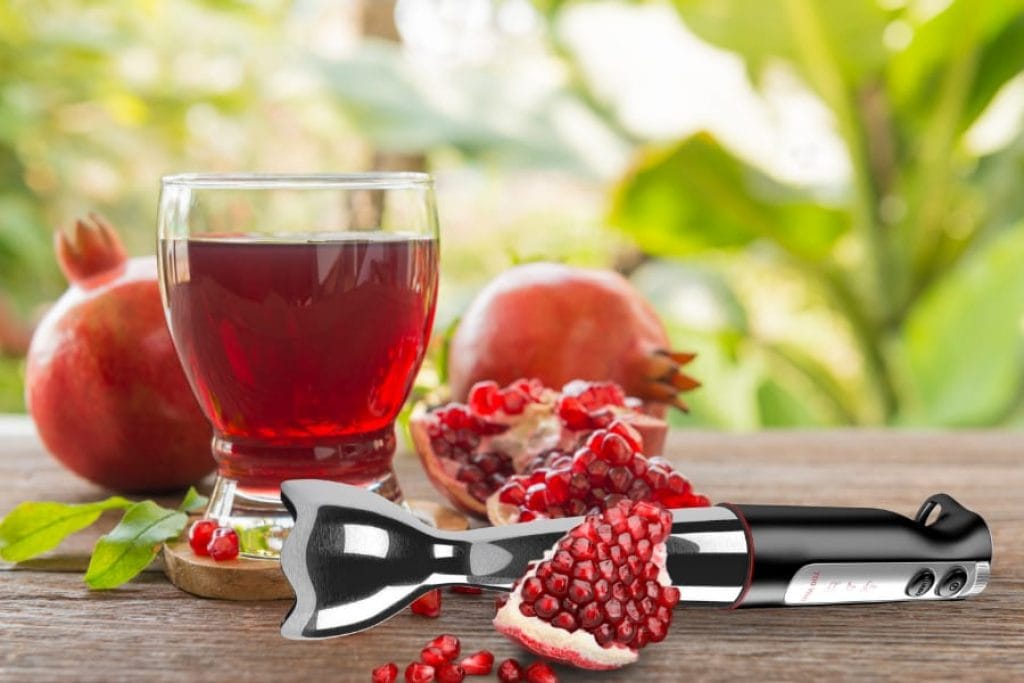 Making pomegranate juice with hand blender