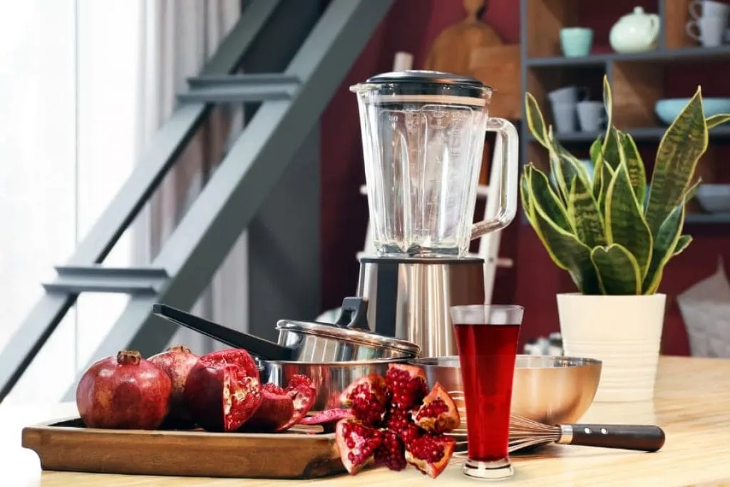 Making pomegranate juice with juicer mixer grinder
